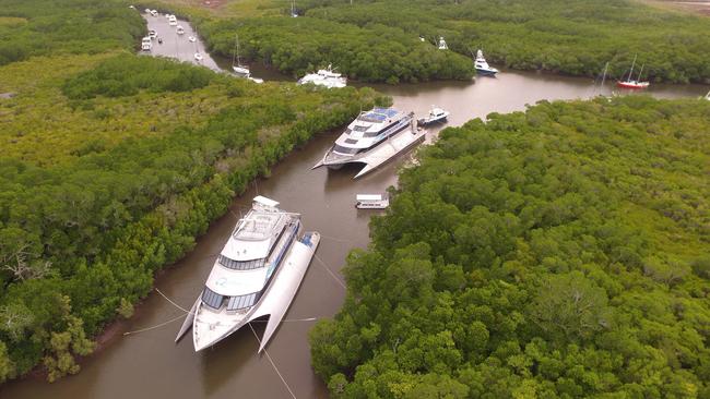 Port Douglas marina empties as Cyclone Jasper approaches, with tourism and fishing vessels seeking refuge in Dickson Inlet’s mangroves. Picture: Port Douglas Boat Hire