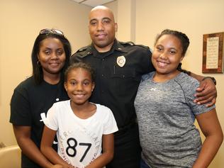 Alfred Cooper’s wife Dashanka and their two daughters pray he’ll come home safe each day. Picture: Gary Ramage