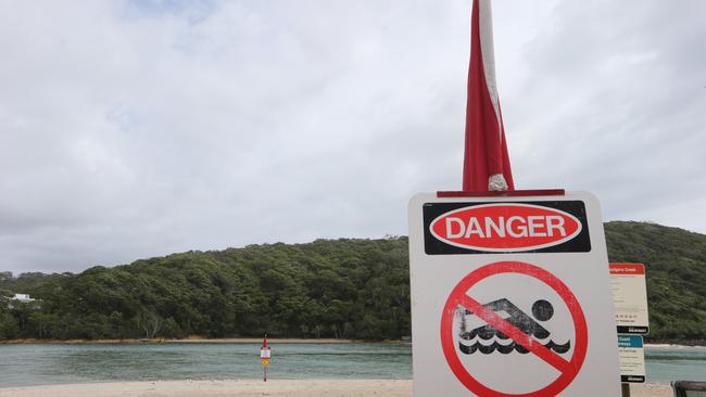 Warning signs are up on Tallebudgera Creek beach after stormwater outflows pollute the pristine waters with debris, causing a hazard to swimmers. Picture Glenn Hampson