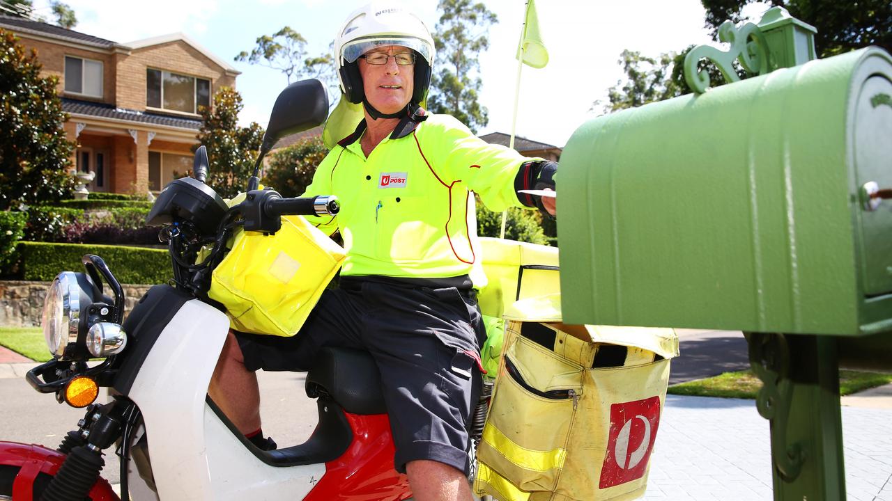 This postie is delivering the mail. Many customers are angry that too often their parcels are not delivered and a card left instead directing them to the Post Office. Picture: AAP Image / Angelo Velardo.