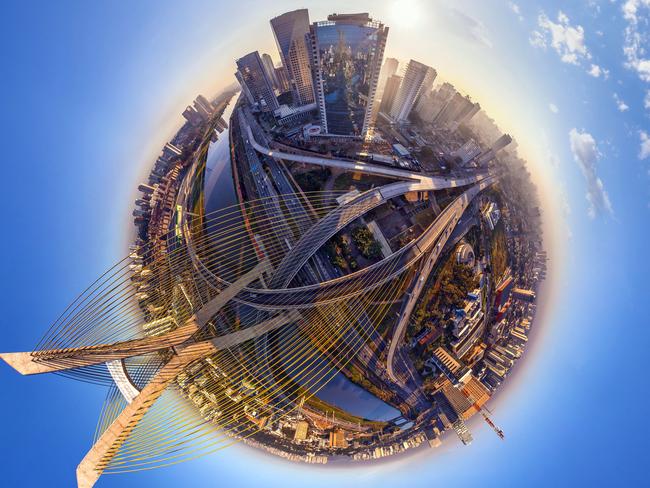 **PLEASE USE CORRECT BYLINE** PIC FROM AIRPANO / CATERSNEWS - (PICTURED: - Octvio Frias de Oliveira Bridge - Sao Paolo, Brazil) Some of the worlds most iconic cities have been photographed as youve never seen them before in the shape of tiny round planets. By using a pioneering method of aerial photography, each location can be now seen at a full 360 degree angle. After some skilful manipulation on Photoshop known technically as stereographic projection, each sweeping panorama is then turned into a small circular shaped image. Whether its the Eiffel Tower, The Empire State Building or the Shanghai Skyline, each image manages to show hundreds of miles of city landscape. SEE CATERS COPY