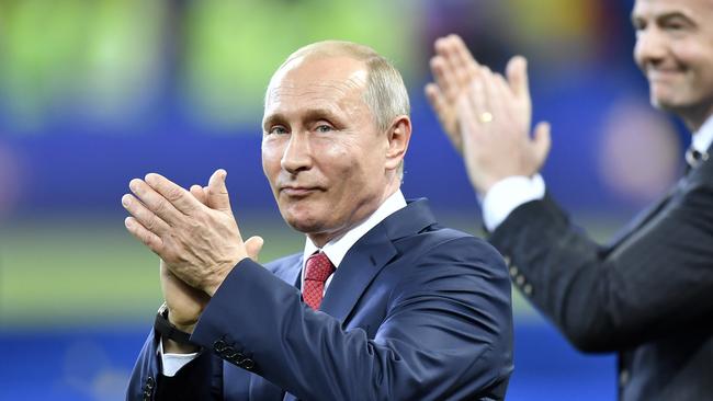 Russian President Vladimir Putin applauds at the conclusion of the 2018 World Cup final. Photo: AP