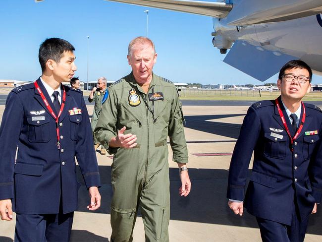 RAAF Air Commodore Stuart Bellingham – then a Group Captain – talking to members of the Japanese Self Defense Force in 2017. Picture: Cpl Nicci Freeman/Department of Defence