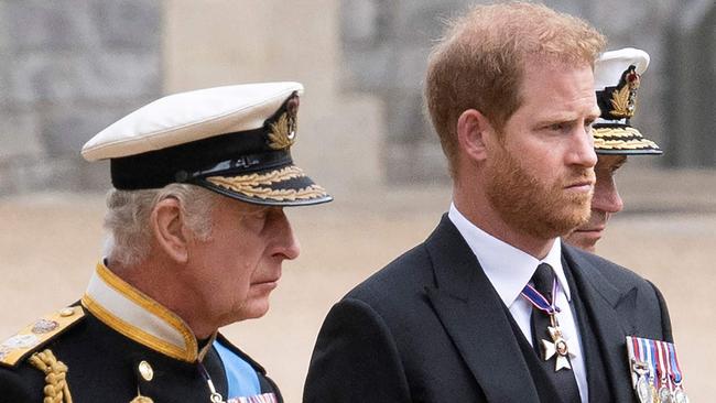 Britain's King Charles III (L) walks with his son Britain's Prince Harry, Duke of Sussex as they arrive at St George's Chapel inside Windsor Castle on September 19, 2022, ahead of the Committal Service for Britain's Queen Elizabeth II. - Monday's committal service is expected to be attended by at least 800 people, most of whom will not have been at the earlier State Funeral at Westminster Abbey. (Photo by David Rose / POOL / AFP)