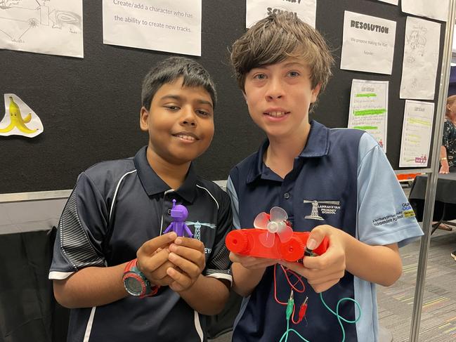 Tarun and Liam from Larrakeyah Primary School show off their 3D-printed products as part of the Makers Empire program. Picture: Annabel Bowles