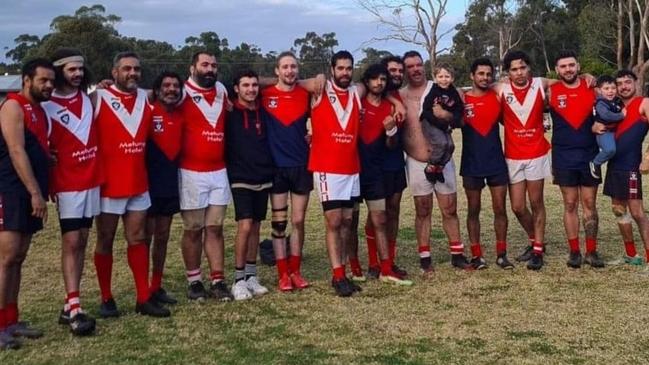 Indigenous players from Swifts Creek and Swan Reach came together after the thrilling finish to the Omeo and District league preliminary final won by Swifts Creek in extra time. Picture: Supplied