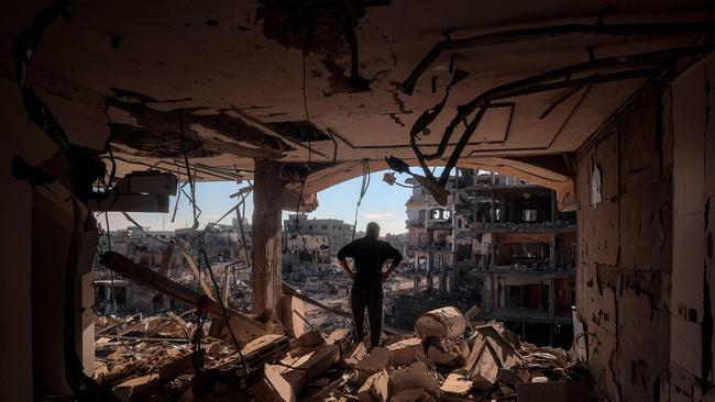 A man stands in a heavily-damaged building without walls in Rafah in the southern Gaza Strip, as residents return following a ceasefire deal in the war between Israel and Hamas. Picture: AFP