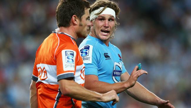 Michael Hooper talks to the referee during a Waratahs match.
