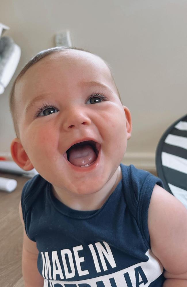 Cooper Swift loves watching football games from his bouncer.