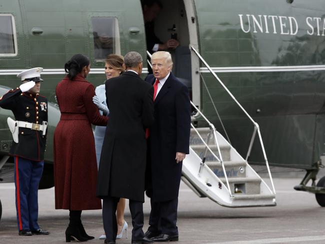 President Donald Trump and first lady Melania Trump talk with former President Barack Obama and Michelle Obama during a departure ceremony on the East Front of the U.S. Capitol in Washington on January 20, 2017, after Trump was inaugurated. Picture: AP