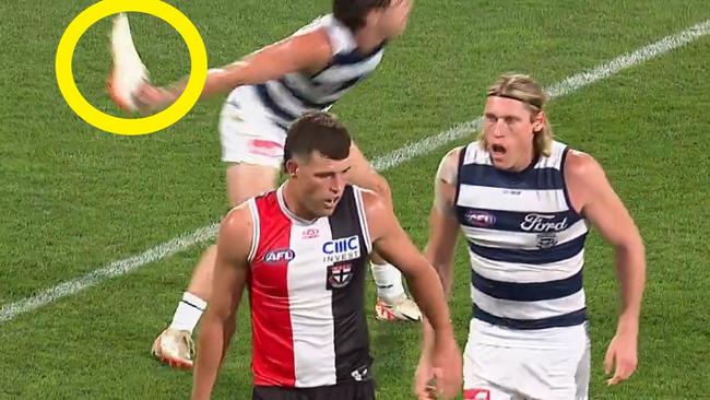 Gryan Miers throws Rowan Marshall's boot away.