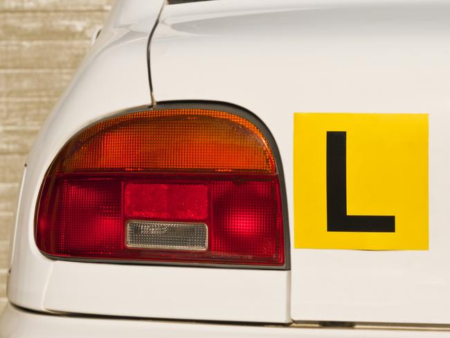 Image Of A Yellow L-Plate On White Car , Indicative Of A Learner Driver. Picture: iStock