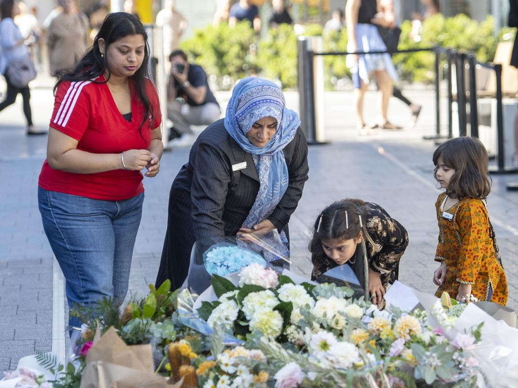 Family members lay flowers on the one-year anniversary of the Westfield Bondi stabbing that killed 6 people. Picture: NewsWire / Jeremy Piper