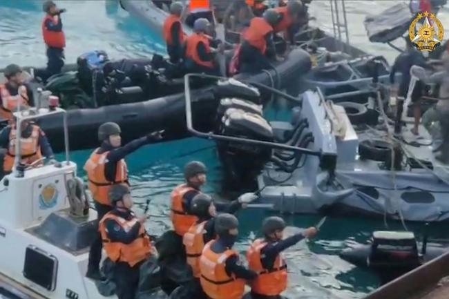 Video from the Armed Forces of the Philippines Public Affairs Office shows China coast guard personnel appearing to wield weapons during an incident off Second Thomas Shoal in the South China Sea