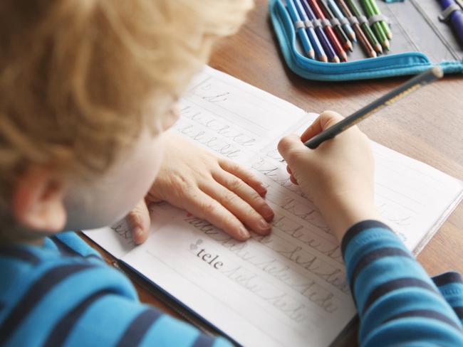 Boy learning to write alphabet characters at school Picture: Istock