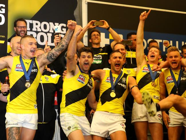 Yellow and black! The Tigers belt out the team song. Picture: Getty