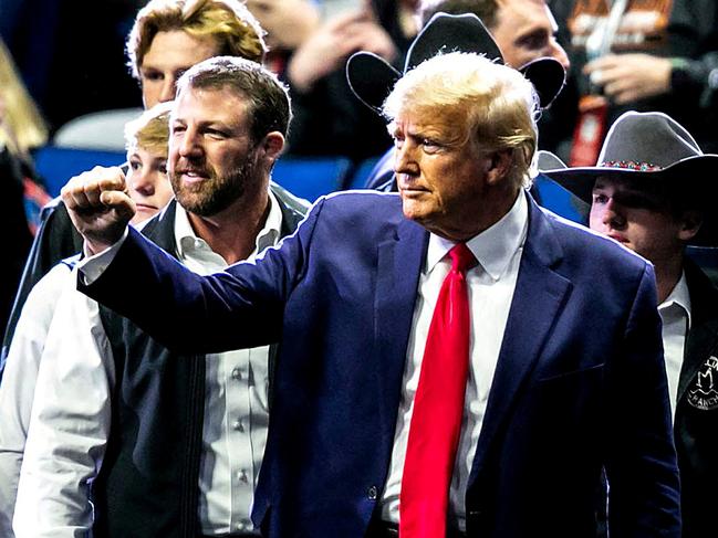 Donald Trump greets fans as he arrives before the finals during the sixth session of the NCAA Division I Wrestling Championships in Oklahoma. Picture: Reuters