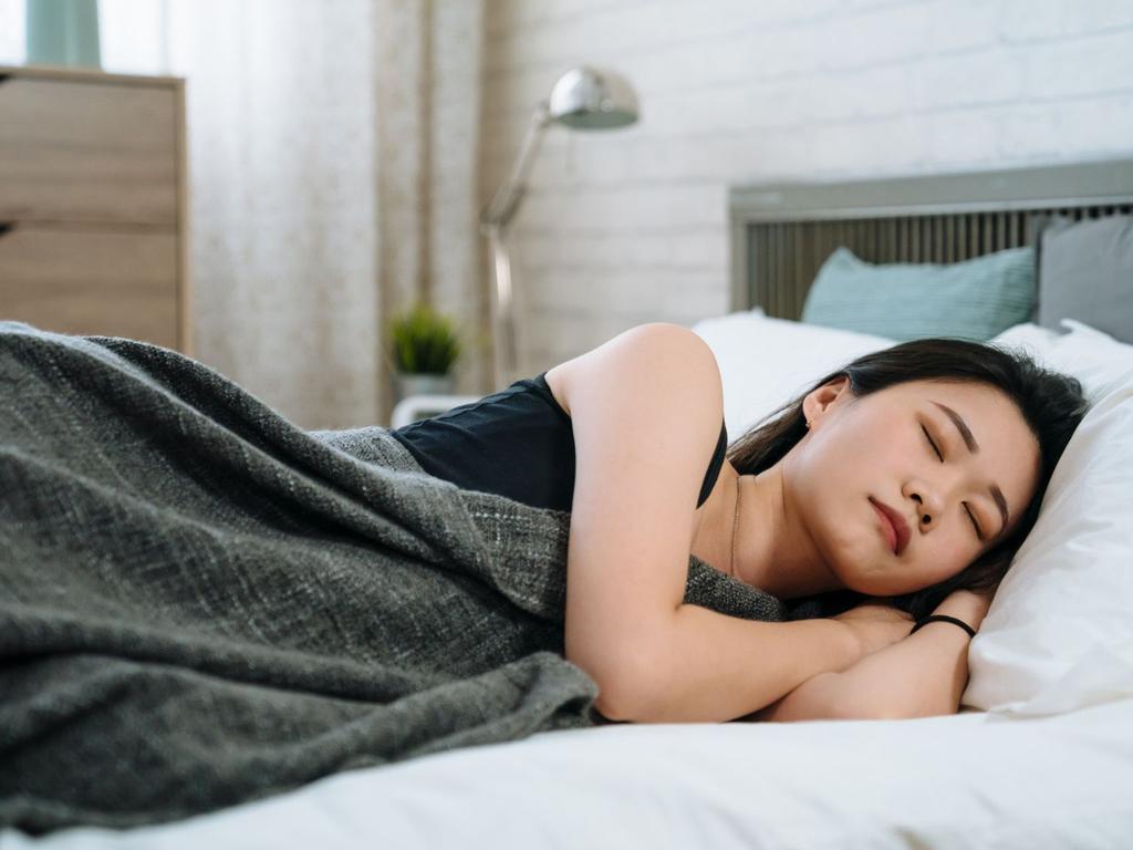 Always wake up on the right side of the bed with these tips on how to choose the best mattress for side sleepers. Picture: iStock/yellowpicturestudio.