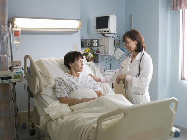 Female doctor comforting female patient lying in hospital bed. generic. Thinkstock. Picture: Supplied