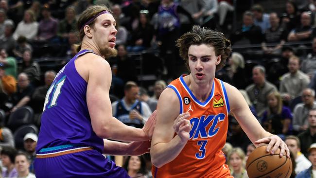 SALT LAKE CITY, UTAH - APRIL 06: Josh Giddey #3 of the Oklahoma City Thunder drives against Kelly Olynyk #41 of the Utah Jazz during the first half of a game at Vivint Arena on April 06, 2023 in Salt Lake City, Utah. NOTE TO USER: User expressly acknowledges and agrees that, by downloading and or using this photograph, User is consenting to the terms and conditions of the Getty Images License Agreement.  (Photo by Alex Goodlett/Getty Images)