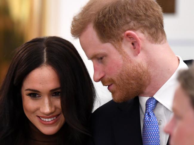 Britain's Prince Harry, Duke of Sussex and Meghan, Duchess of Sussex react during their visit to Canada House in thanks for the warm Canadian hospitality and support they received during their recent stay in Canada,  in London on January 7, 2020. (Photo by DANIEL LEAL-OLIVAS / various sources / AFP)