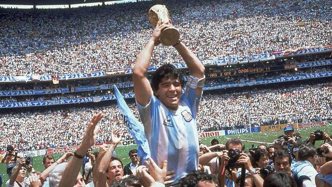 ** FILE ** In this June 29, 1986 file photo Diego Maradona of Argentina celebrates with the cup at the end of the World Cup