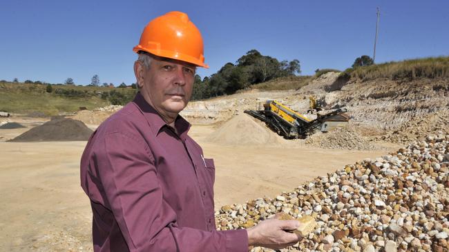 Former Lismore City Council mayor Jeff Champion inspects some product at Champions Quarry, Wyrallah Road, Tucki Tucki.