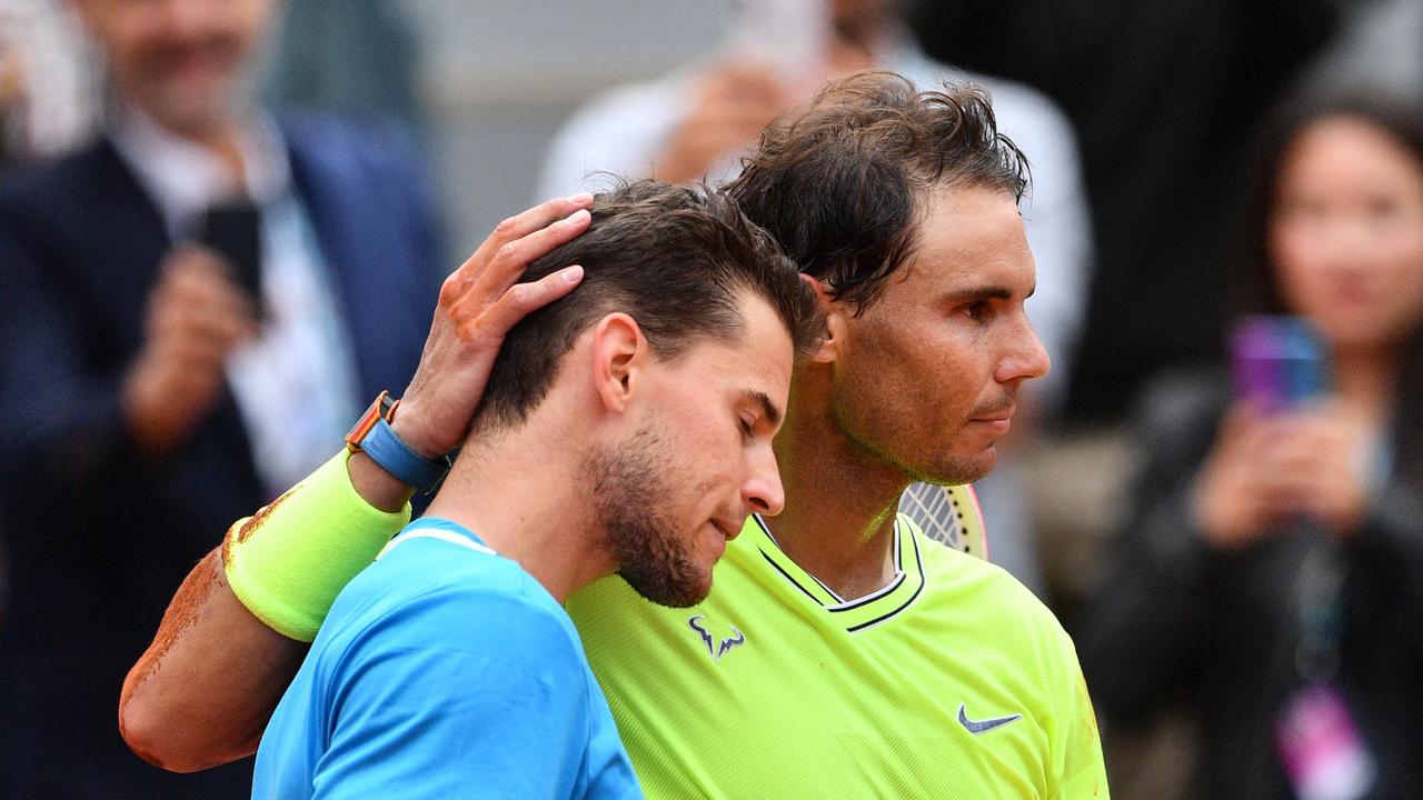 Nadal consoles Thiem after the 2019 French Open final. Photo by Martin BUREAU / AFP