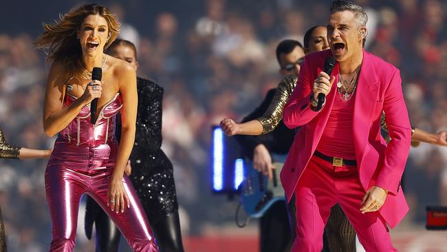 Robbie Williams and Delta Goodrem perform during the 2022 AFL Grand Final match on September 24, 2022 in Melbourne. Picture: Daniel Pockett/AFL Photos