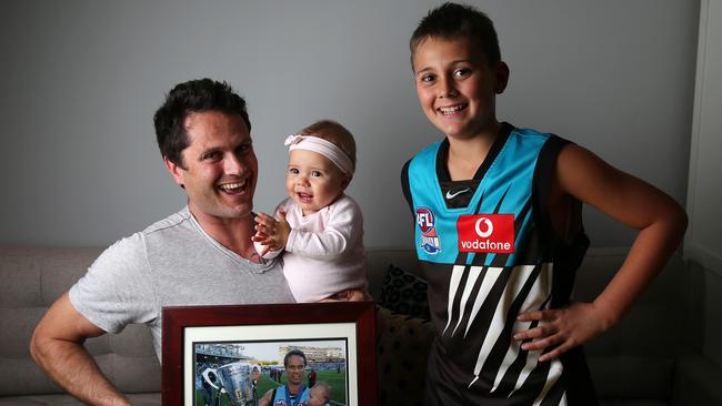 Gavin Wanganeen and Tex in 2014, as well as daughter Kitty. Picture: Sarah Reed.