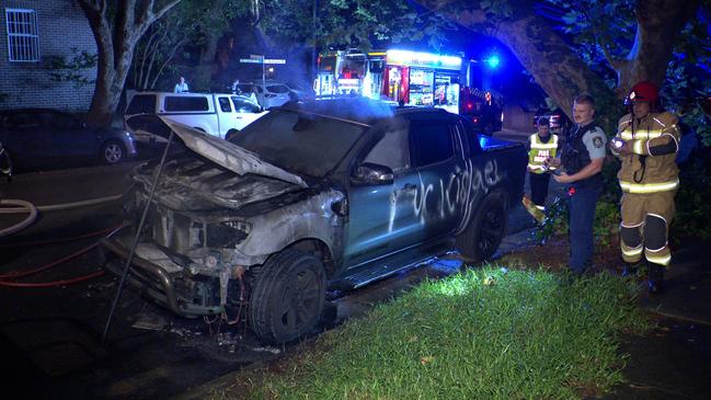 Police attend the torched car on Thursday morning in Woollahra. Picture: OnScene Bondi