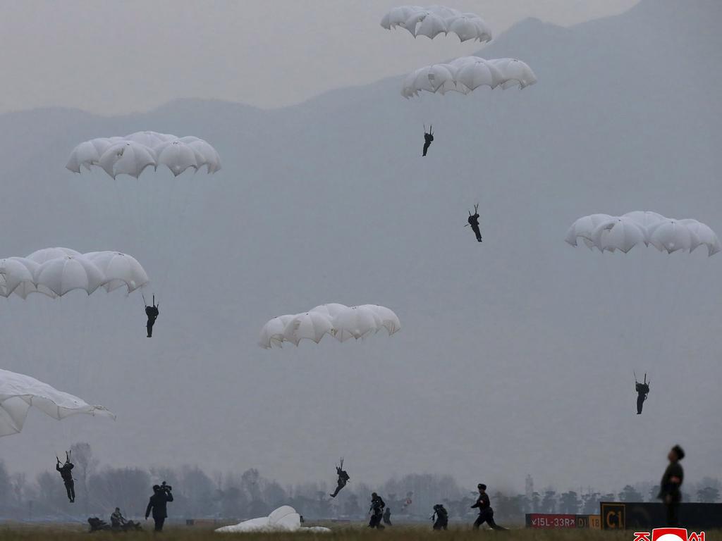 A parachuting drill of military sharpshooters at an unknown location supervised by Kim Jong-un. Picture: Korean Central News Agency/Korea News Service via AP