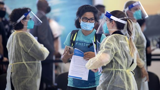 Passengers have their documents checked at Melbourne Airport. Picture: NCA NewsWire / David Geraghty