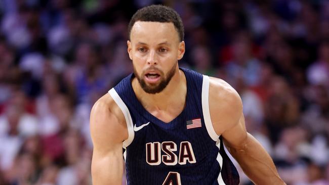 LILLE, FRANCE - JULY 28: Stephen Curry #4 of Team United States drives to the basket during the second half of the Men's Group Phase - Group C game between Serbia and the United States on day two of the Olympic Games Paris 2024 at Stade Pierre Mauroy on July 28, 2024 in Lille, France. (Photo by Gregory Shamus/Getty Images)