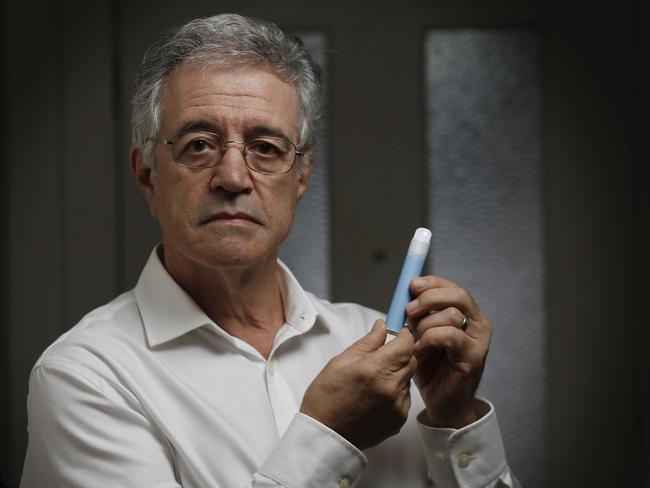 Dr Colin Mendelsohn with an e-cigarette. He says prohibition is a failed strategy and vapes should be sold to over-18s in licensed shops to help people get off cigarettes. Picture: John Appleyard