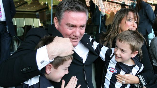 McGuire celebrates Collingwood's 2010 premiership with wife Carla and sons Joseph and Alexander at the MCG.