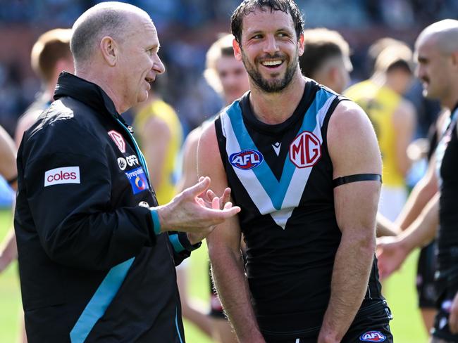 ADELAIDE, AUSTRALIA - AUGUST 27:Ken Hinkley coach of Port Adelaide  and  Travis Boak of Port Adelaide  celebrate the win after  the round 24 AFL match between Port Adelaide Power and Richmond Tigers at Adelaide Oval, on August 27, 2023, in Adelaide, Australia. (Photo by Mark Brake/Getty Images)