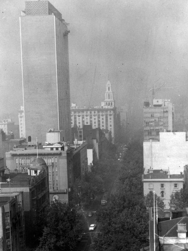 A smoke pall hangs heavily over the city — a grim remind of the raging Dandenongs bushfire.