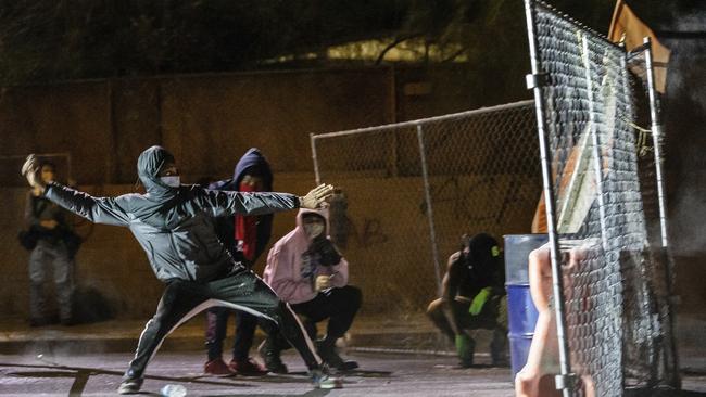 A man about to let fly at police in Tucson, Arizona, on Sunday. Picture: AP