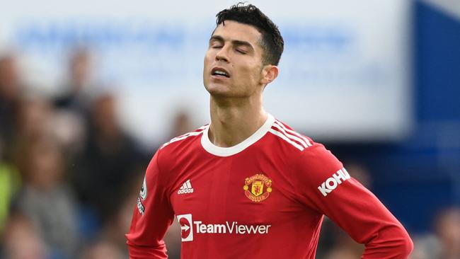 Manchester United's Portuguese striker Cristiano Ronaldo reacts during the English Premier League football match between Brighton and Hove Albion and Manchester United at the American Express Community Stadium in Brighton, southern England on May 7, 2022. (Photo by Glyn KIRK / AFP) / RESTRICTED TO EDITORIAL USE. No use with unauthorized audio, video, data, fixture lists, club/league logos or 'live' services. Online in-match use limited to 120 images. An additional 40 images may be used in extra time. No video emulation. Social media in-match use limited to 120 images. An additional 40 images may be used in extra time. No use in betting publications, games or single club/league/player publications. /