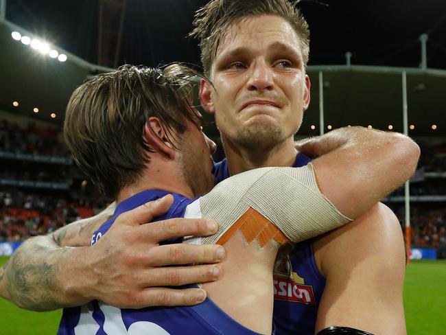 Clay Smithy embraces Caleb Daniel after the siren at Spotless Stadium.