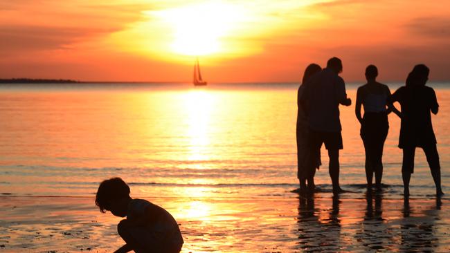 People at Mindil beach catch the sunset at the opening of Mindil Markets in 2015.