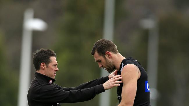 McRae lending Travis Cloke a hand with his goalkicking in 2013.