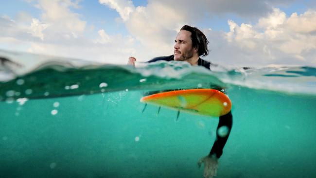 Local surfer Adam Goode is aware of the risk but it won't stop him surfing at Lighthouse Beach, Ballina. Picture: Luke Marsden.