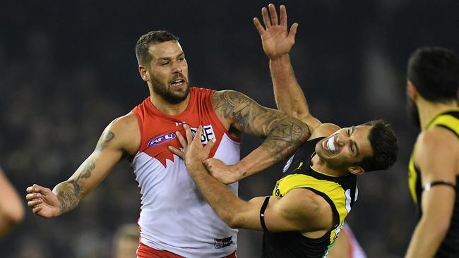 Lance Franklin shoulders Alex Rance.