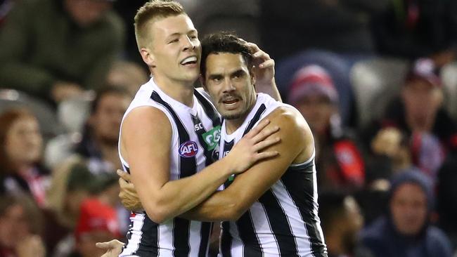 Jordan de Goey and Daniel Wells celebrate a goal.