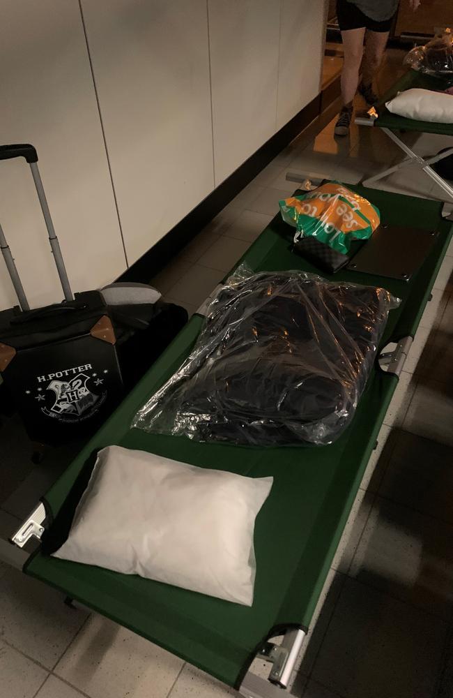 Matthew Creed showed the bed he slept in overnight at Schiphol Airport in Amsterdam. Picture: PA/AAP