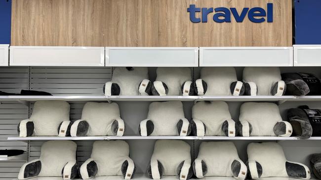 Shelves once full of suitcases in the travel section are now stocked with back rest pillows to fill empty space. Picture: Benedict Brook/news.com.au