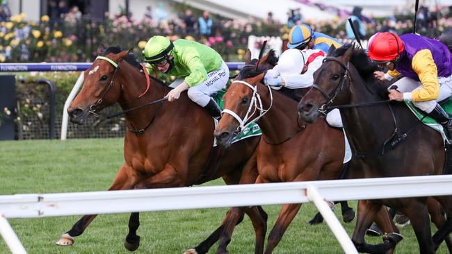 Affair to Remember (green) ridden by Michael Poy wins the TAB Matriarch Stakes. Pic: Racing Photos.