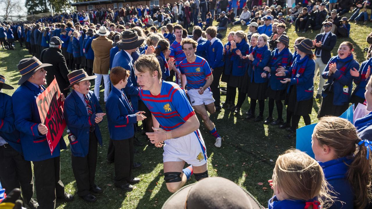 Downlands First XV run on to the field through a tunnel of students for the O'Callaghan Cup.